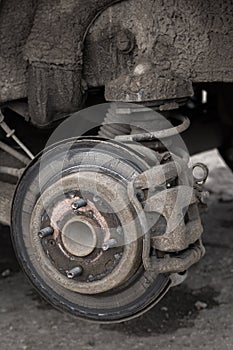Old shabby disc brake in wheel arch
