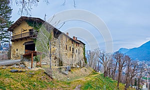 The old shabby medieval San Maurizio Church in Lugano, Switzerland photo