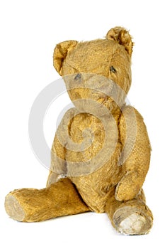 Old Shabby Teddy Bear Sitting Isolated on White