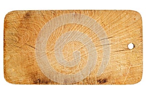 The old, shabby, used, small wooden chopping board isolated on a white background