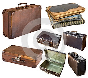 Old shabby vintage suitcases and book isolated on white background. Retro style