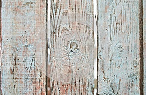 Old shabby wooden planks with cracked color paint, background. light blue