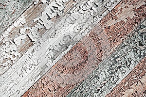 Old shabby wooden planks with cracked color paint, background. multicolor