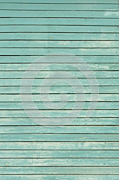 Old shabby wooden wall painted light blue
