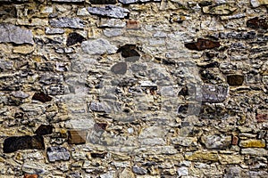 Old shapeless stones create the texture of stone cladding