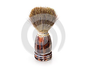 Old shaving brush isolated. Retro mens swab stand on white backg