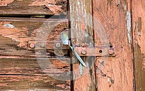 Old shed locked with a spoon