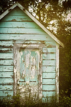 Old shed with worn Paint and old Door