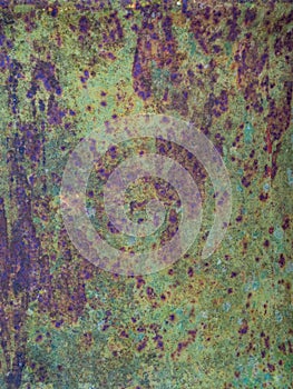 Old sheet of iron covered with a red-brown color with old green stained paint decaying metal, grunge background