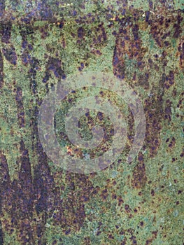 Old sheet of iron covered with a red-brown color with old green stained paint decaying metal, grunge background