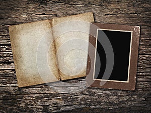 Old sheet paper and old photo on vintage wooden background