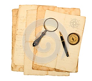 Old  sheets with compass rose magnifying glass and fountain pen