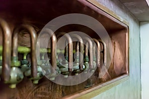 Old shiny copper taps at the brewery production