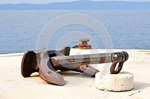 Old ship anchor in port