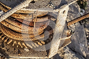 Old Ship Dock Winch With Corroded Gear Wheel And Rusty Steel Cable Coil Detail