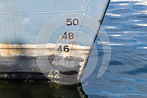 Old ship draft on hull, scale numbering. Distance between waterline and bottom keel