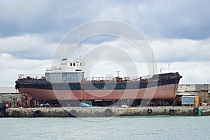 An old ship in a graving dock in Yalta port