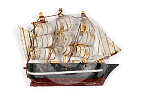 Old ship model. Sailboat on a white background.