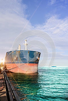 Old ship moored alongside in shipyard