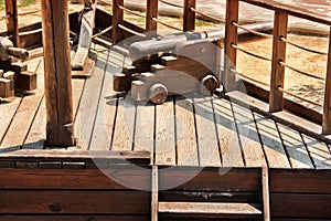 The old ship. Part of a wooden ship. Weapons on a ship