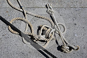 Old Ship rope knot on pier background