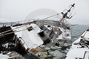 Old ship sank at the pier