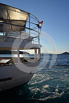 Old ship stern at sunset