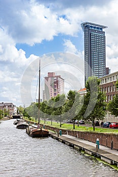 Old ships and modern skyscrapers at the canal in Den Haag