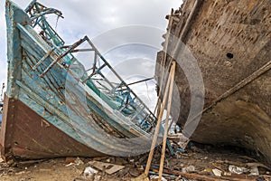 An old shipwreck boat abandoned stand on beach or Shipwrecked off the coast of Jeddah Saudi Arabia.