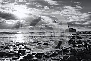 Old shipwreck long exposure on the rocks sunset artistic conversion