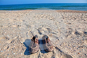 Old shoes on the beach