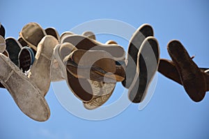 Old shoes hanging on a wire