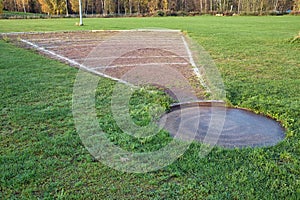 old shot put pit ring and lines on an athletics track outdoors