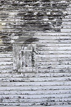 Old wooden shutter with peeling paint