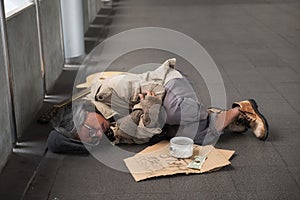 Old sick beggar or Homeless man in city