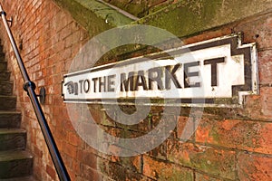 Old Sign Pointing Way To Market