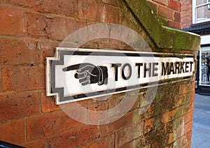 Old Sign Pointing Way To Market