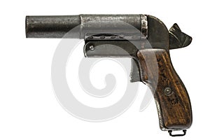 Old signal pistol, flare gun with the hammer cocked, isolated