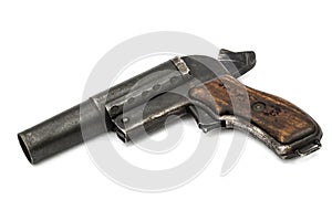 Old signal pistol, flare gun with the hammer cocked, isolated