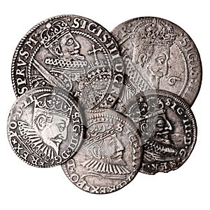 Old silver coins 16-17th century isolated on white. Ortsthaler and triple groschen with portrait of Sigismund III Vasa