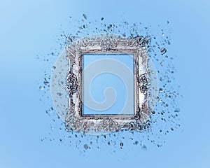 Old silver frame on a light blue background