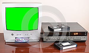 Old silver green screen TV for video and photos with built-in DVD player and a vintage video recorder from the 1980s, 1990s, 2000s photo