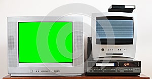 Old silver and green TV for video and photo with built-in DVD player and vintage VCR. photo