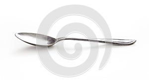 Old silver spoon isolated on white with clipping path included photo