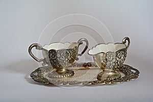 Old silver sugar bowl and creamer on silver tray