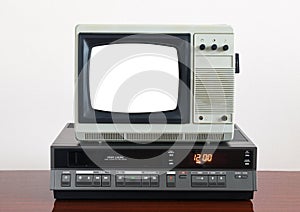 Old silver vintage TV with white screen to add new images to the screen, VCR on wallpaper background.