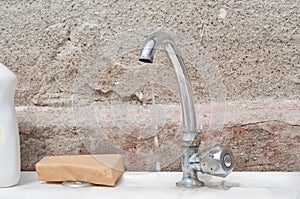 Old sink with flowing water