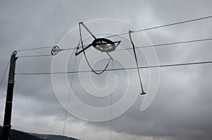 An old ski lift where with the help of a rope and a rod with a plastic plate, which the skier denies, or s sits down and lets hims