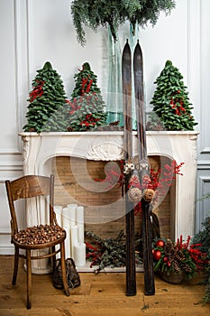 Old skis. Christmas decor with old skis., acorns and candles.