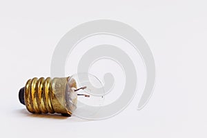 An old small light bulb on white background